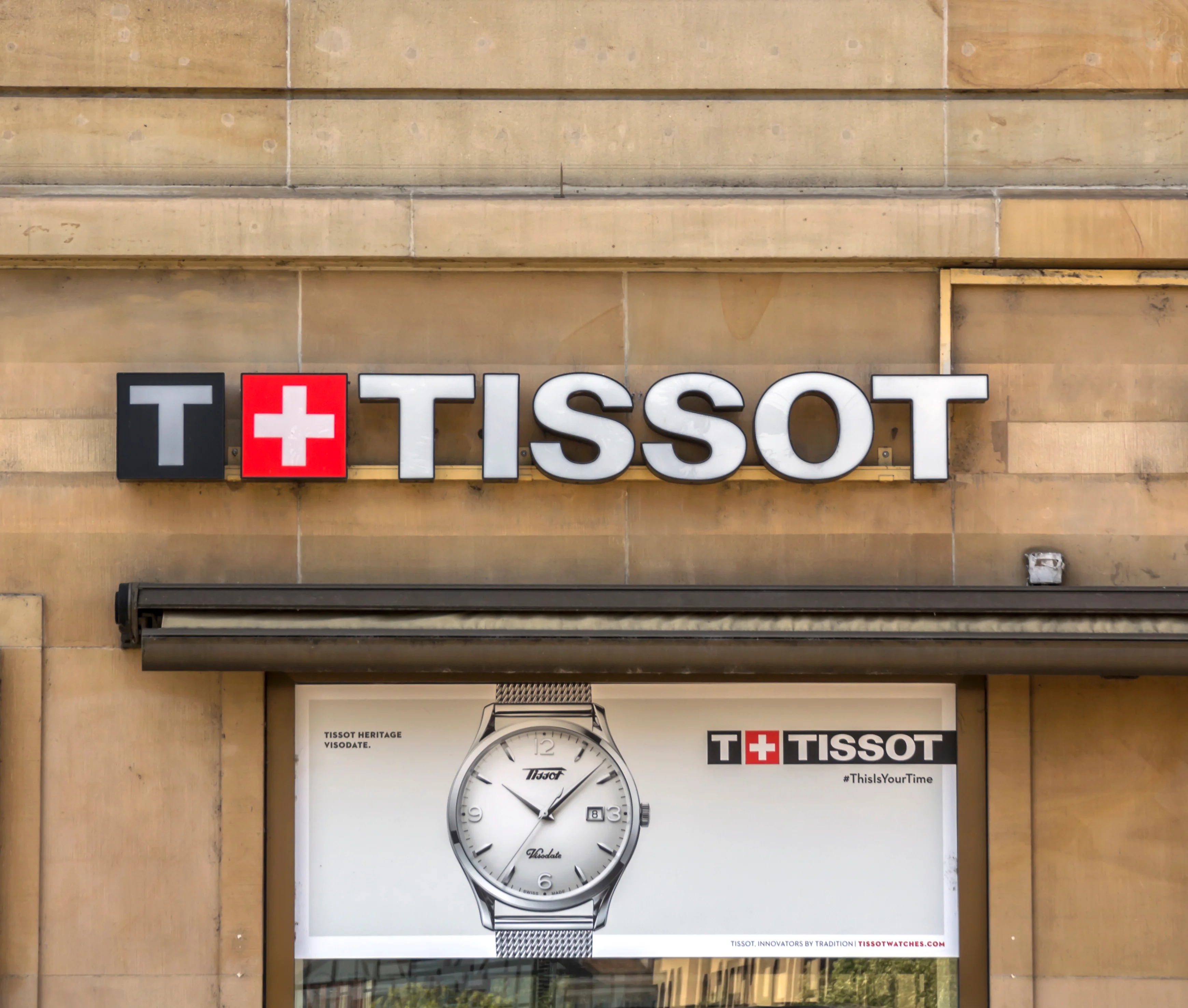 Tissot watch showing case back markings, serial numbers, and identification features