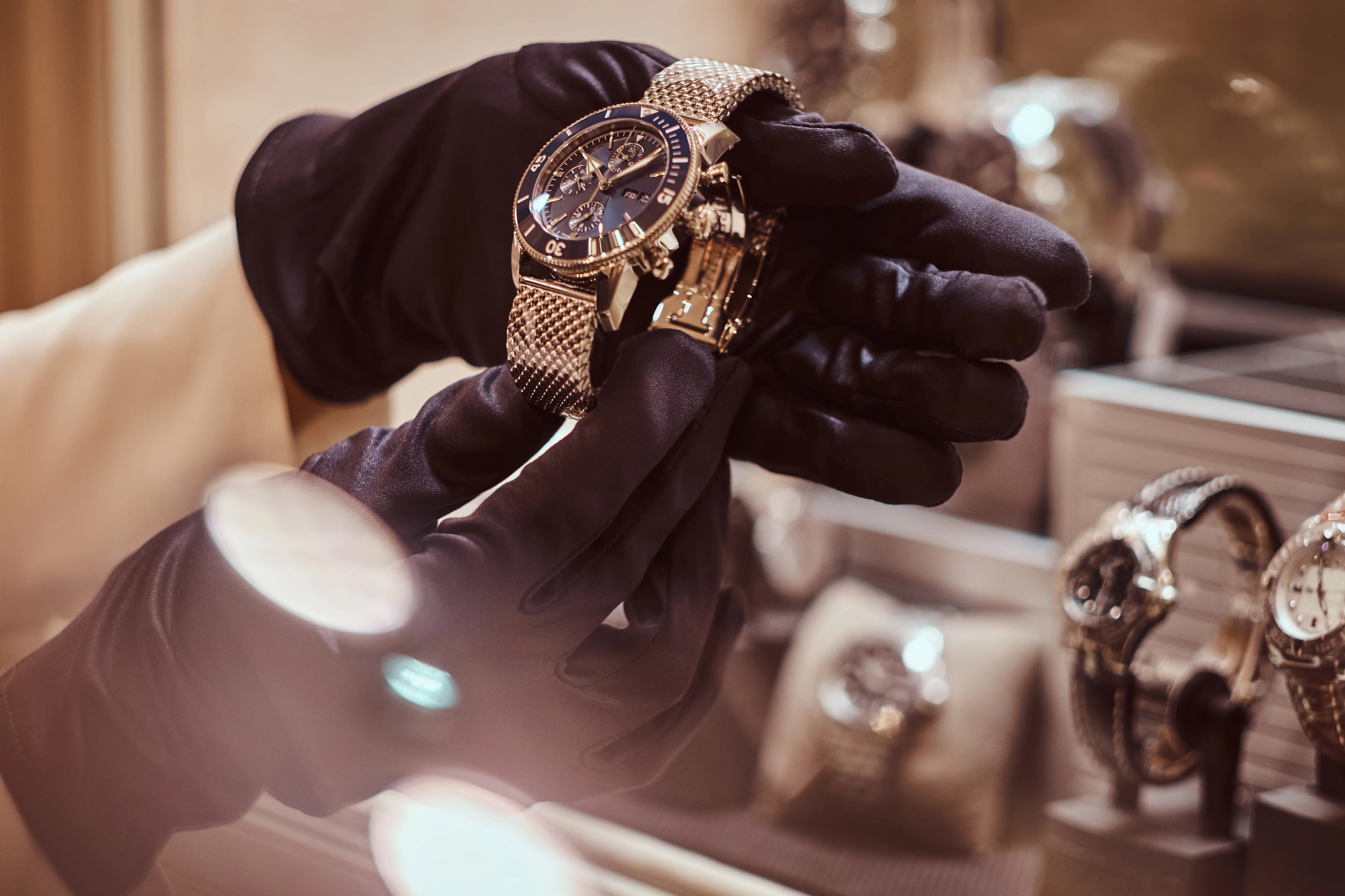 A wristwatch being examined by hand