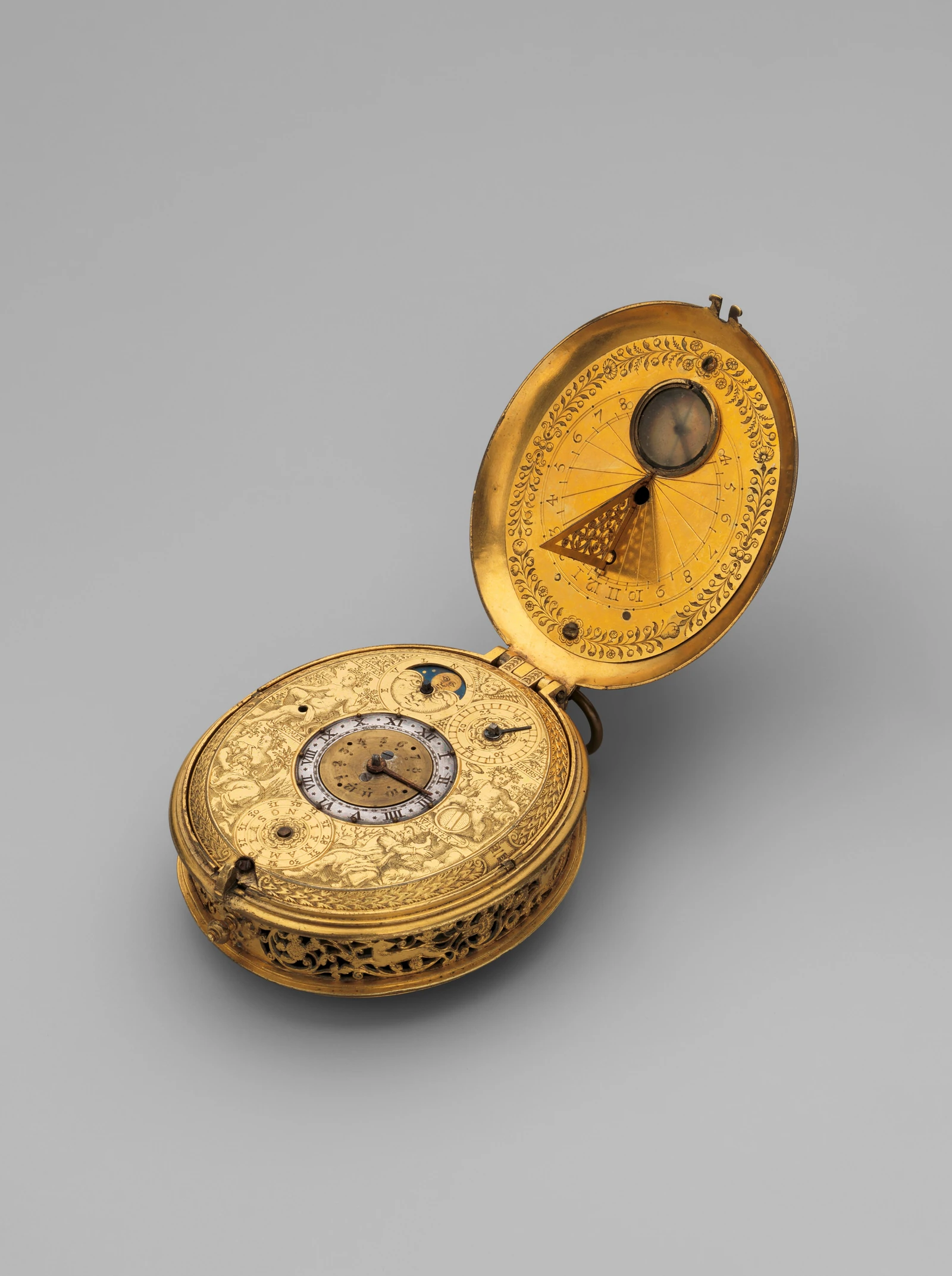 Ornate antique gold pocket watch with open case