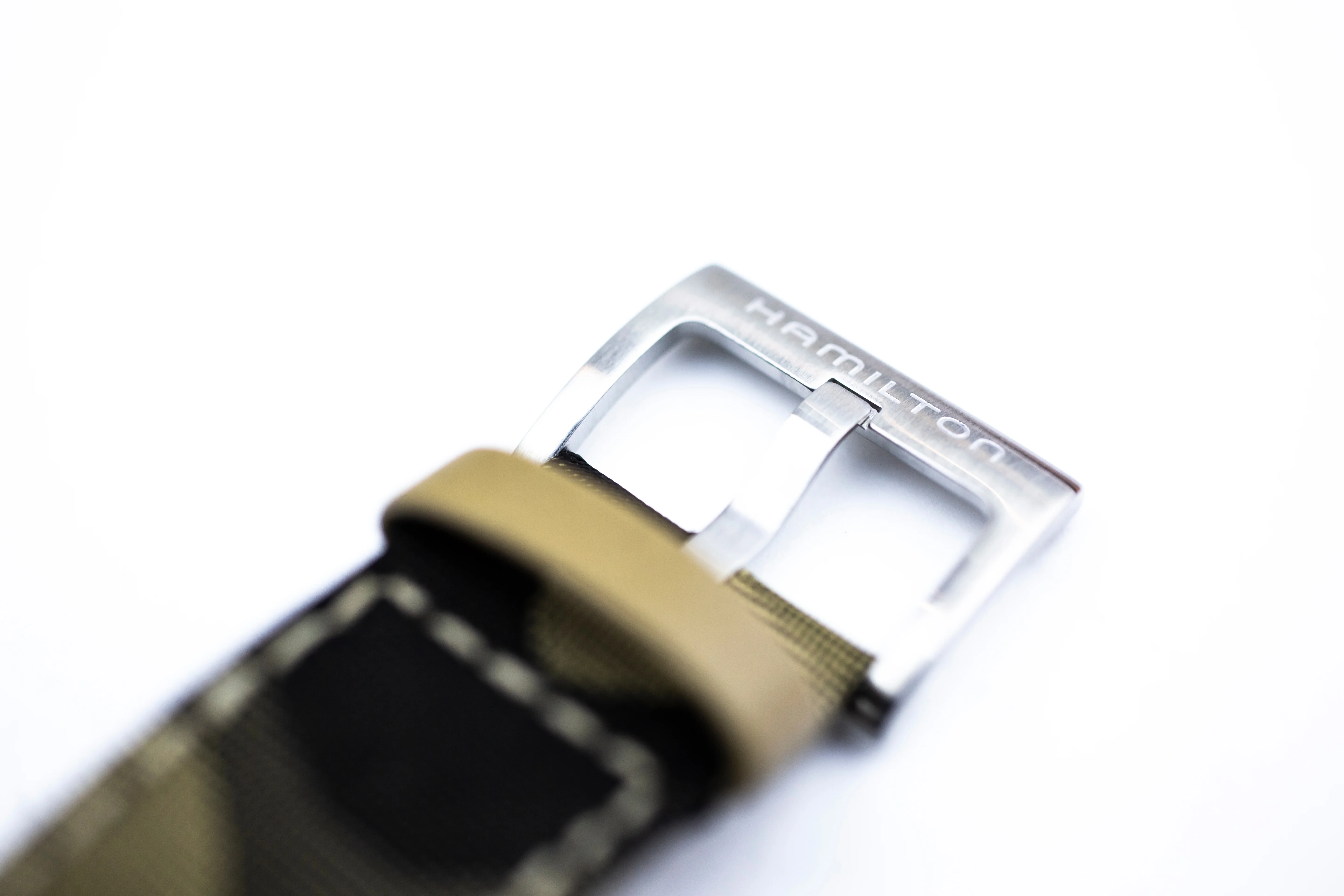 Example of Deployment Clasp Marking marking found on a watch — close-up identification photo
